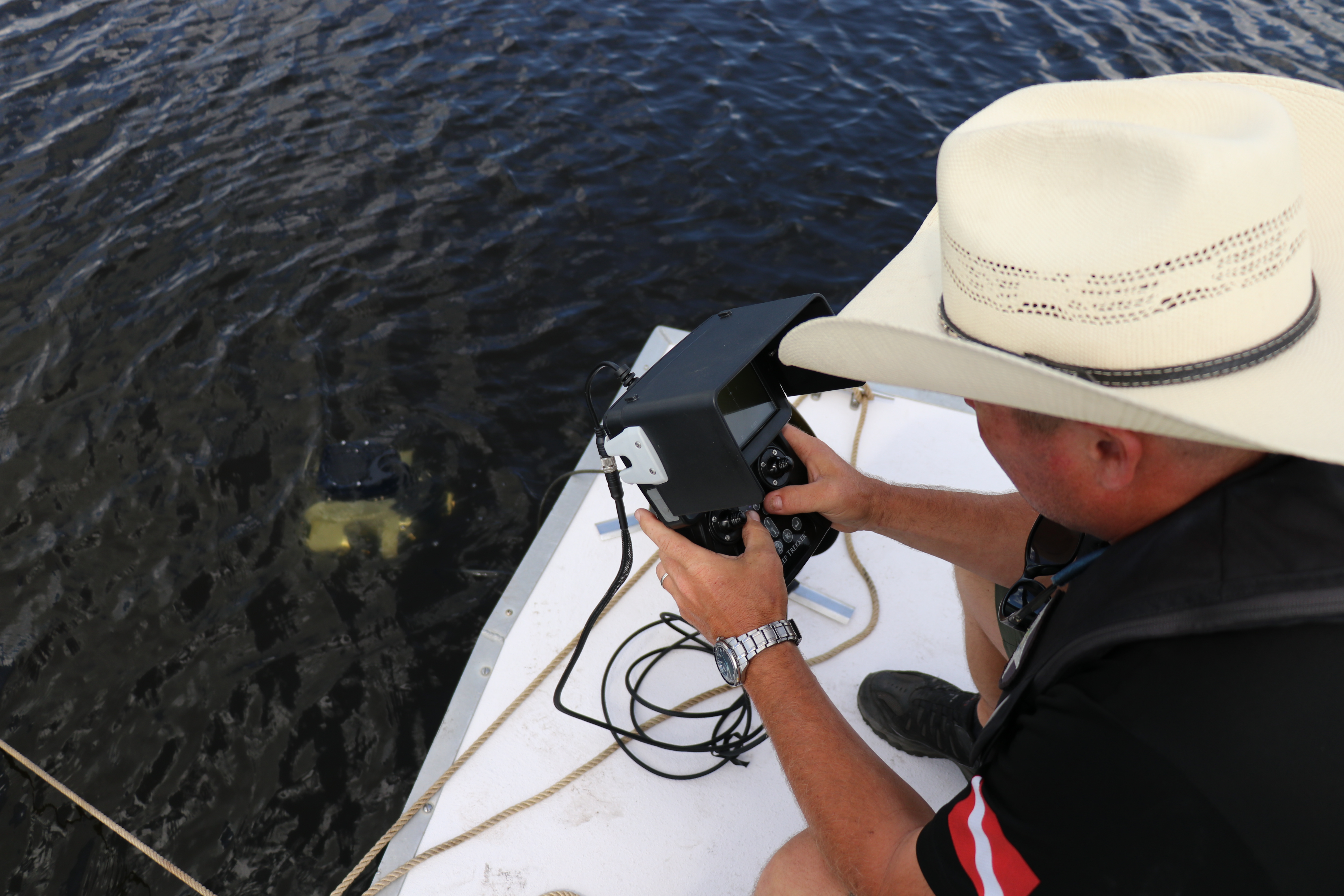 [stock image of DS Williamson using underwater drone during training]